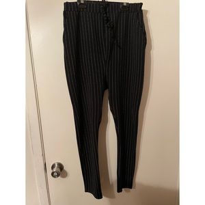 Black with white pinstripes, high waisted trousers, with pockets